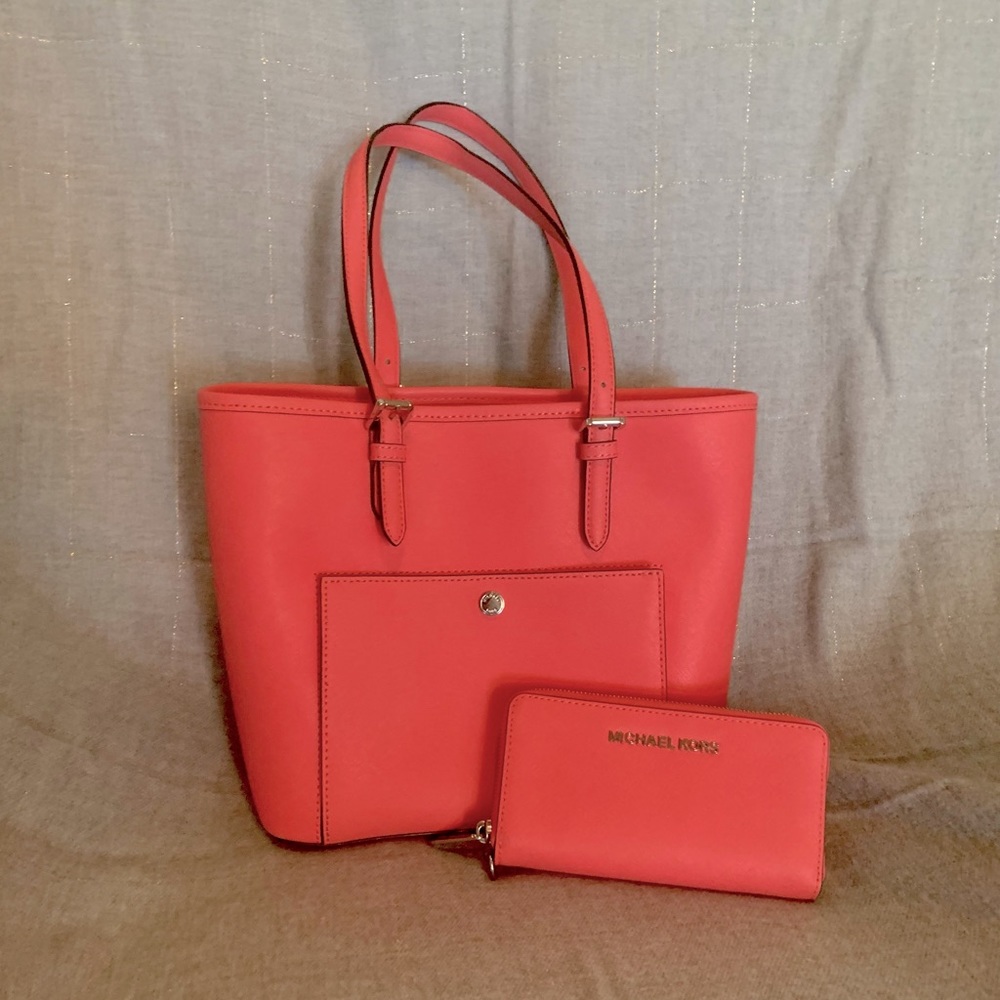 Coral Michael Kors bag with matching wallet.